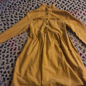 I am selling a orangish-brown dress. It is unbottonable and soft. It is worn